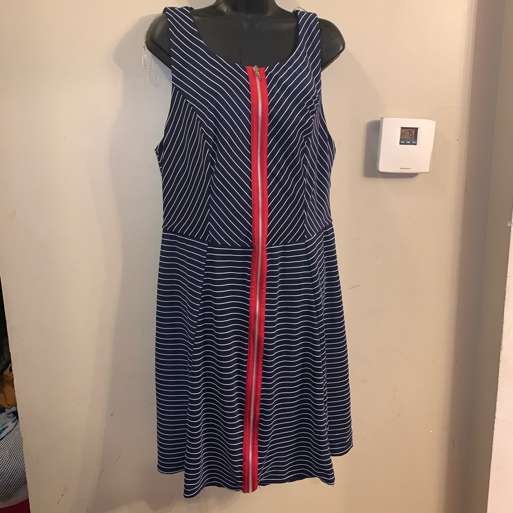 Blue and white dress with a red zipper